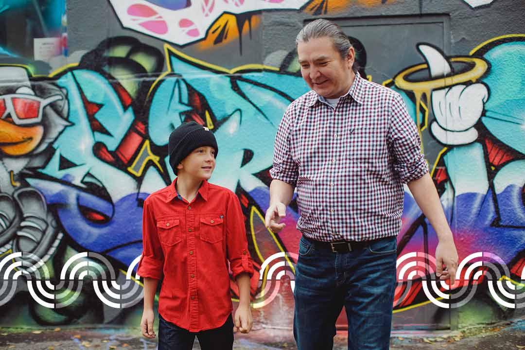 Indigenous Mentee and Mentor walking in alley